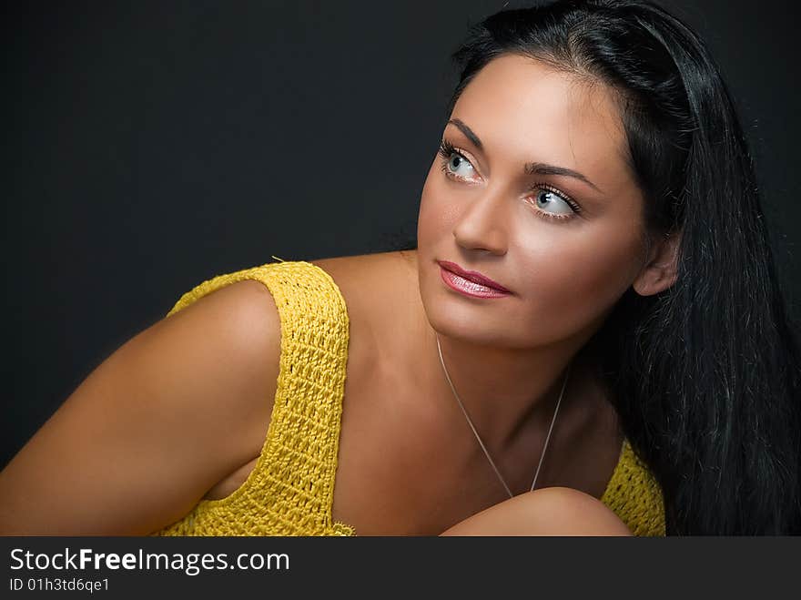 Portrait of charming young woman on black background. Portrait of charming young woman on black background