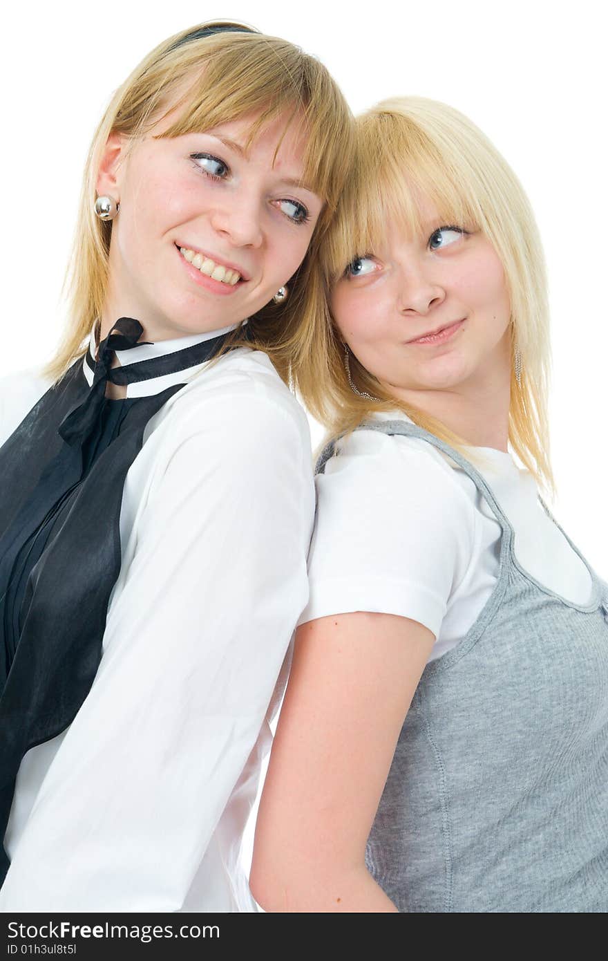 The two young glamour girls isolated on a white background