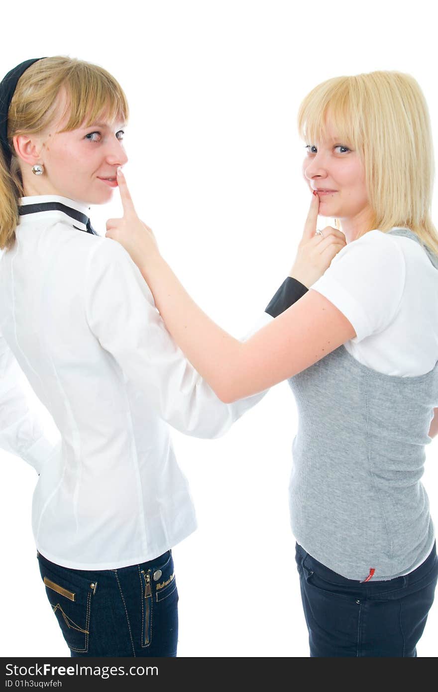 The two young glamour girls isolated on a white background