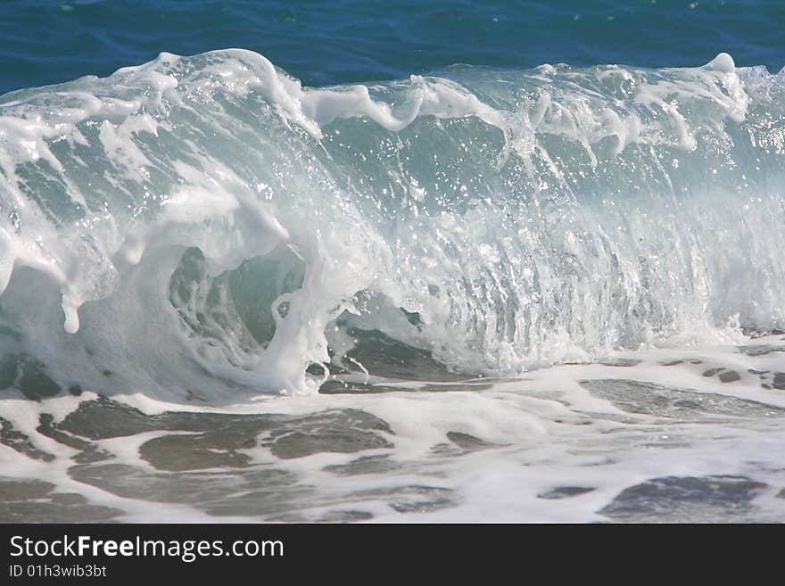 The Twirled Sea Wave Approaching On Coast