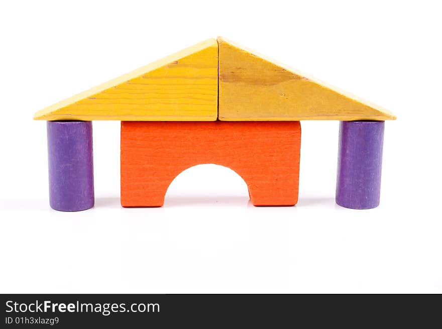 Toy blocks stacked like a house with pillars. Toy blocks stacked like a house with pillars