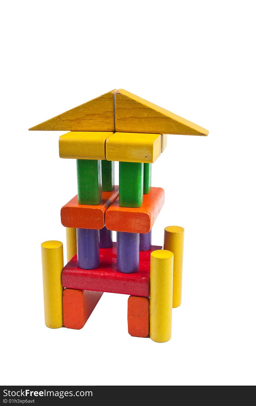 Toy blocks stacked like a tower with pillars. Toy blocks stacked like a tower with pillars