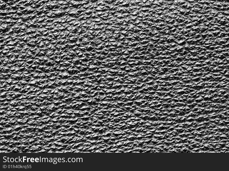 A close-up of the texture of black leather. A close-up of the texture of black leather