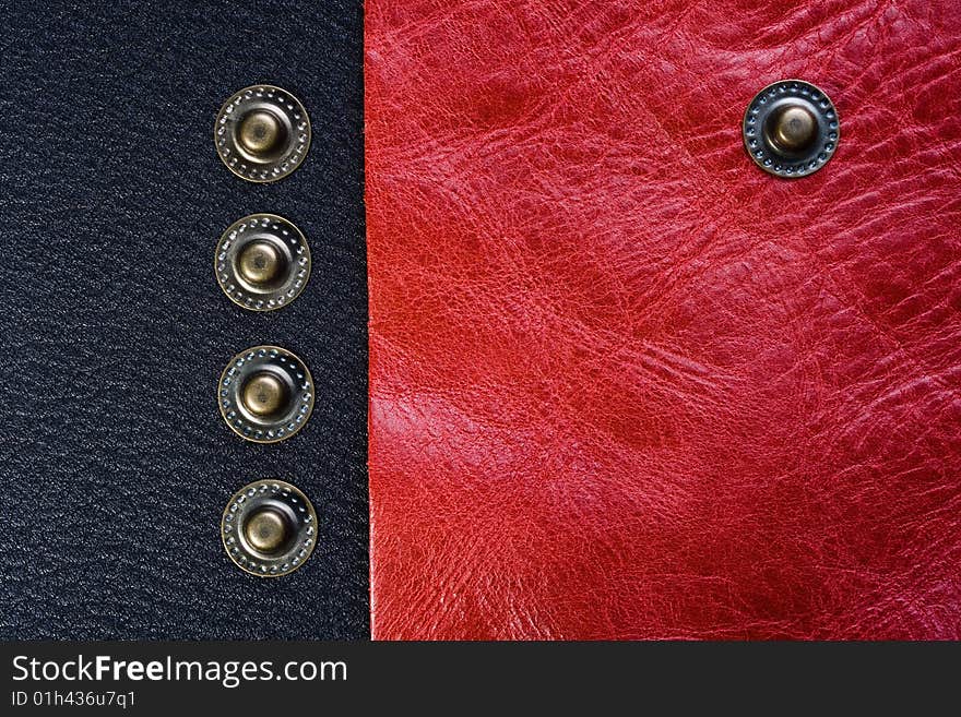 Five buttons on the black and pink leather