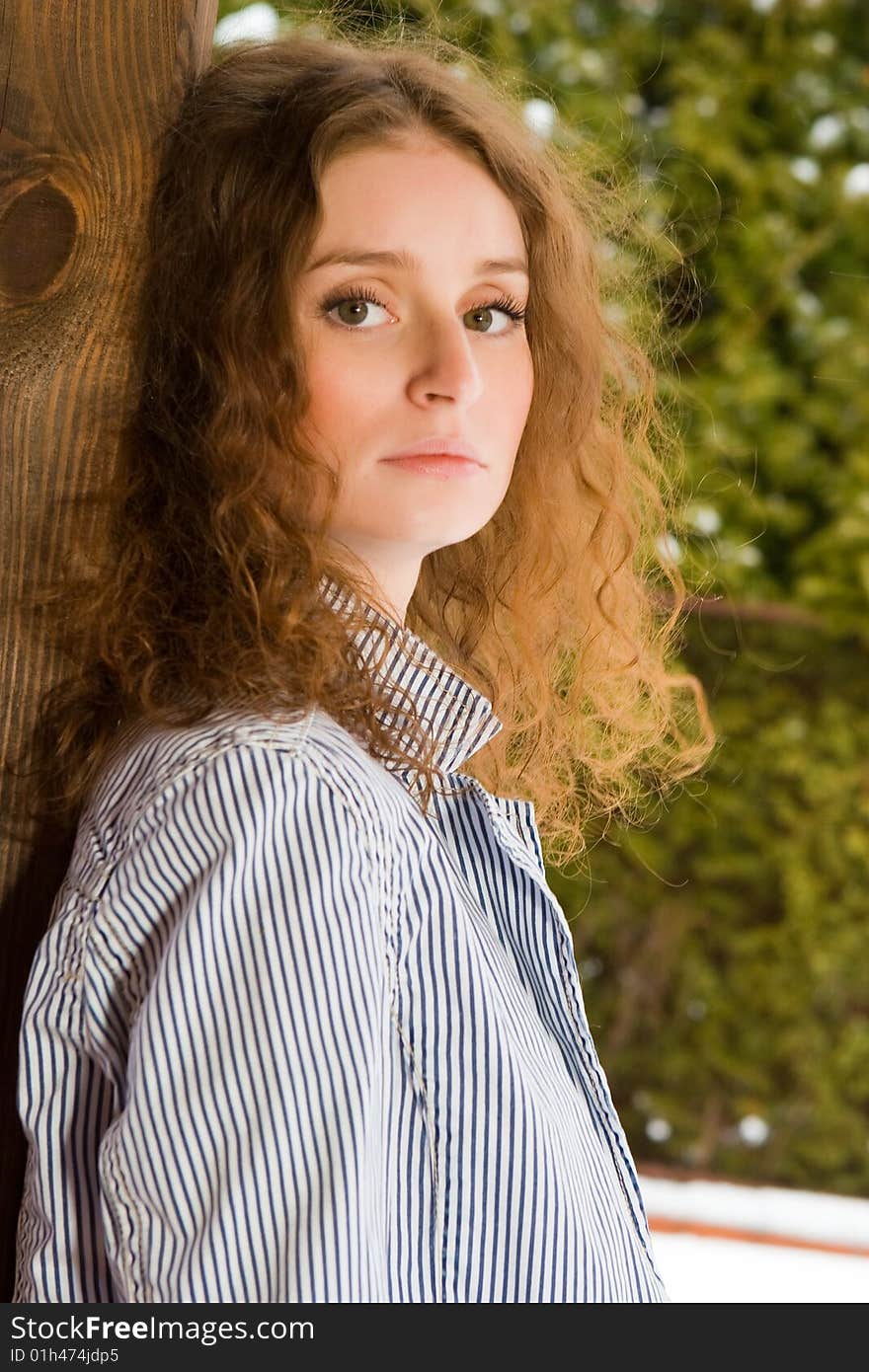 Beautiful young woman stand on a verandah. Beautiful young woman stand on a verandah