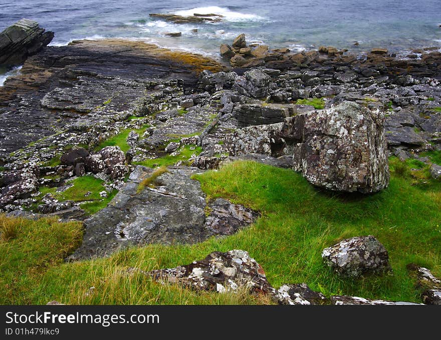 Grass, rocks and sea