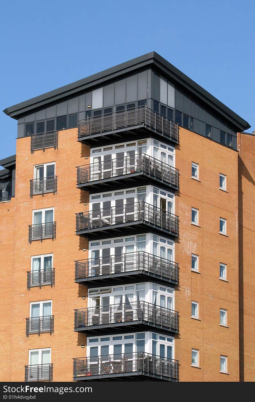 Modern residential block on side of River Thames