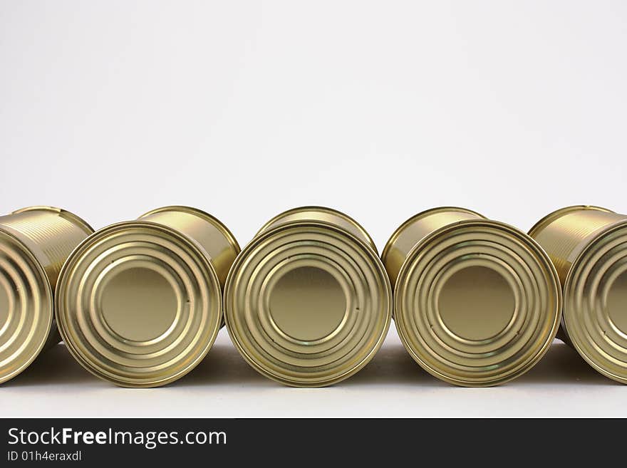 Tin cans in line on white background. Tin cans in line on white background