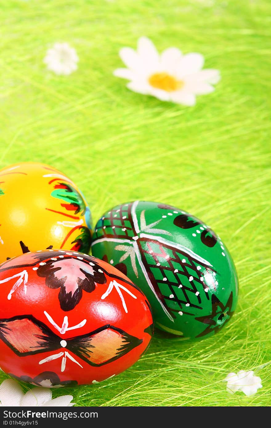 Painted Colorful Easter Eggs on green Grass