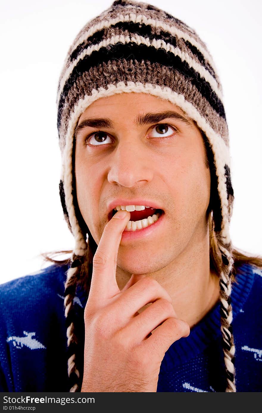 Top view of young man looking through lens against white background