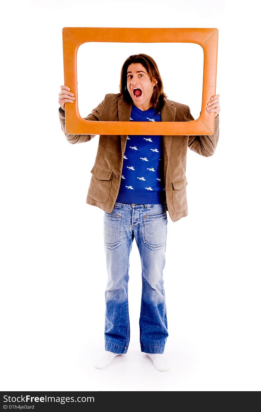 Top view of young man looking through lens against white background