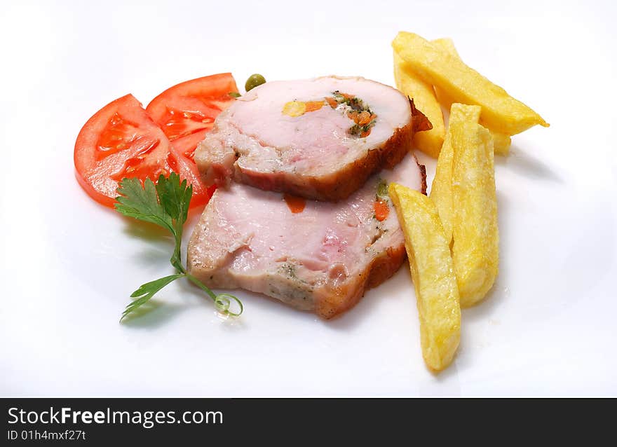 Fillet of chicken with tomato in plate. Fillet of chicken with tomato in plate.