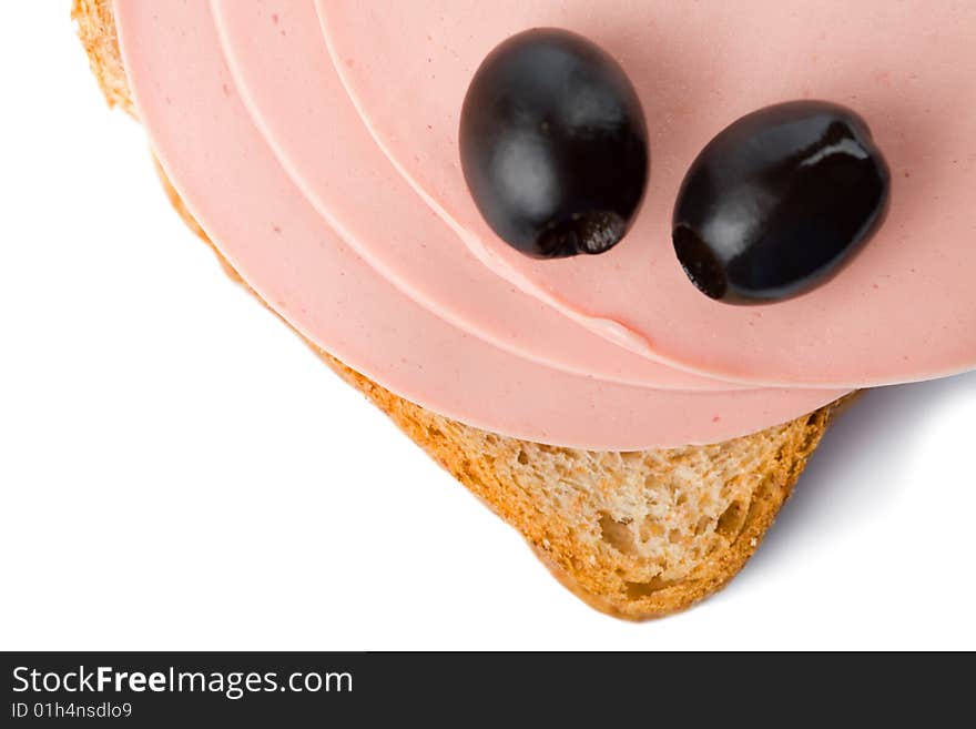 Bread with sausage and olives isolated