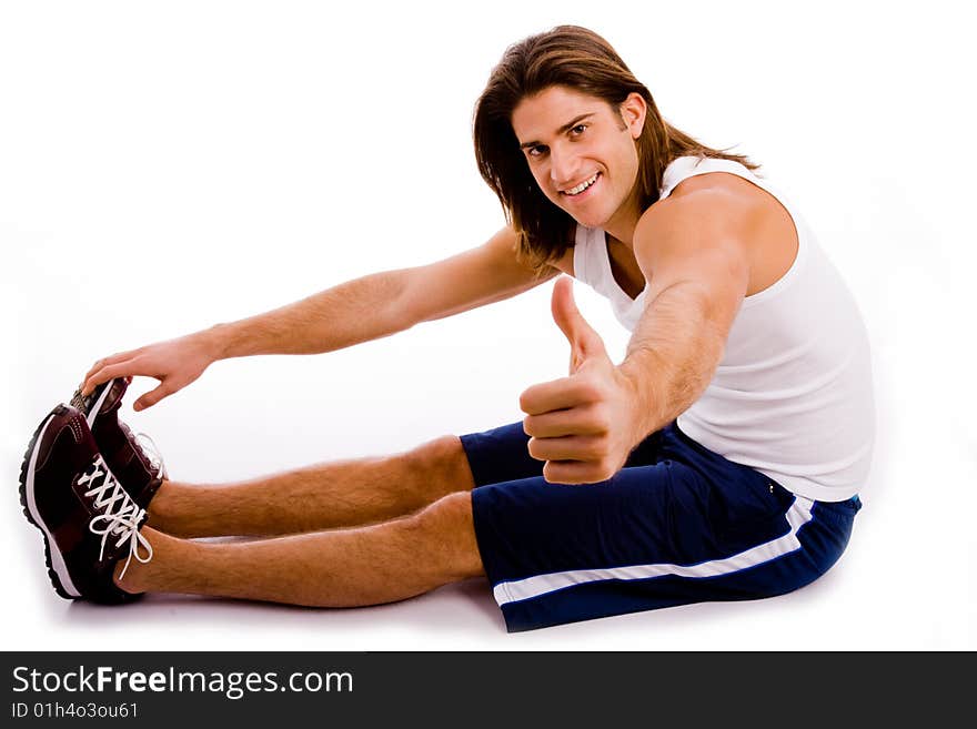 Portrait of powerful man showing muscles on an isolated white background