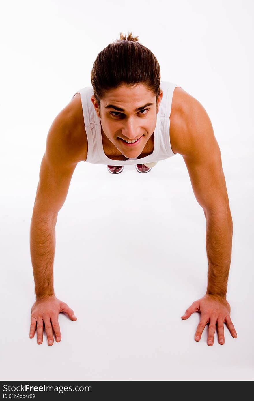 Portrait of powerful man showing muscles on an isolated white background