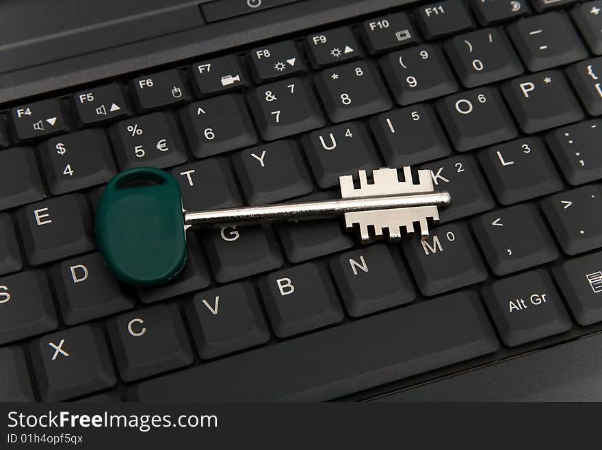 Computer Security conception. Key on laptop