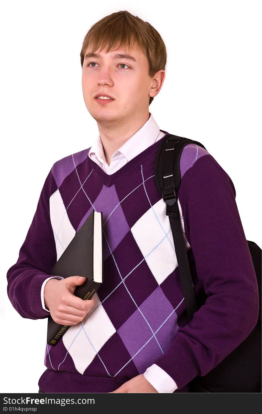 Young happy student carrying bag and books on white background