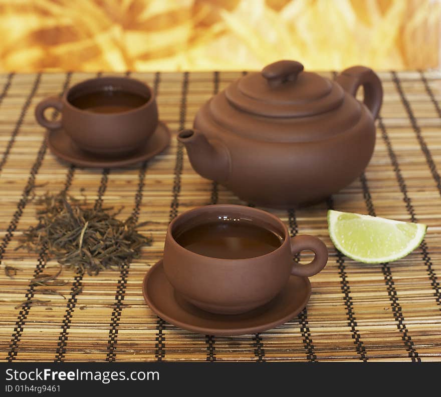 Chinese clay teapot and two cups