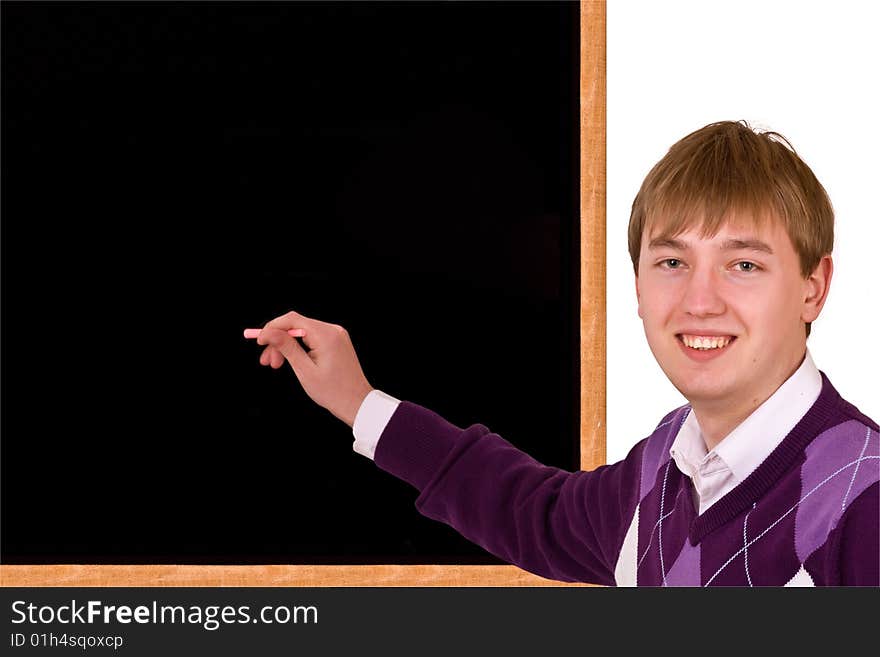 Young Man standing by blank blackboard with stick of chalk in her hand on white background. Young Man standing by blank blackboard with stick of chalk in her hand on white background