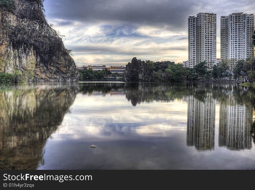 This image Bukit Batok Town Park (Little Guilin) of Singapore has an AdobeRGB(1998) color profile.  The colors in the Dreamstime preview image differ slightly from the actual AdobeRGB(1998) colors.  The image actual colors will be rendered properly in an image viewer that understands AdobeRGB(1998).