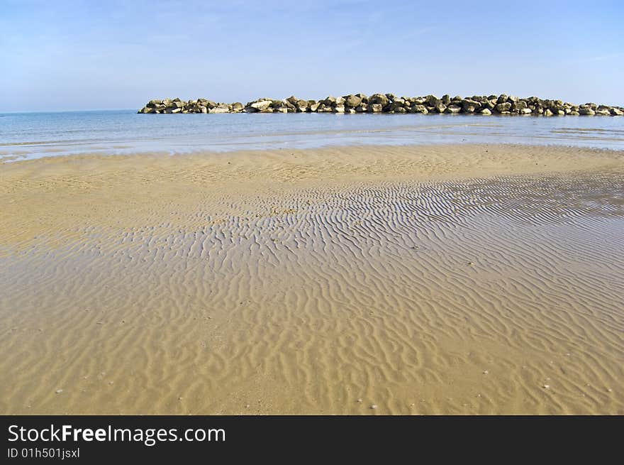 Beach with a stone wall