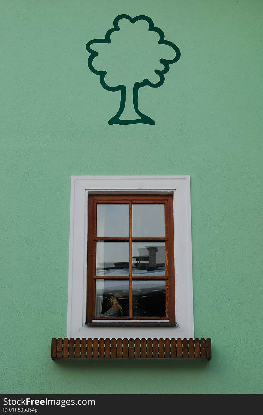 Window with tree painted on the green wall. Window with tree painted on the green wall