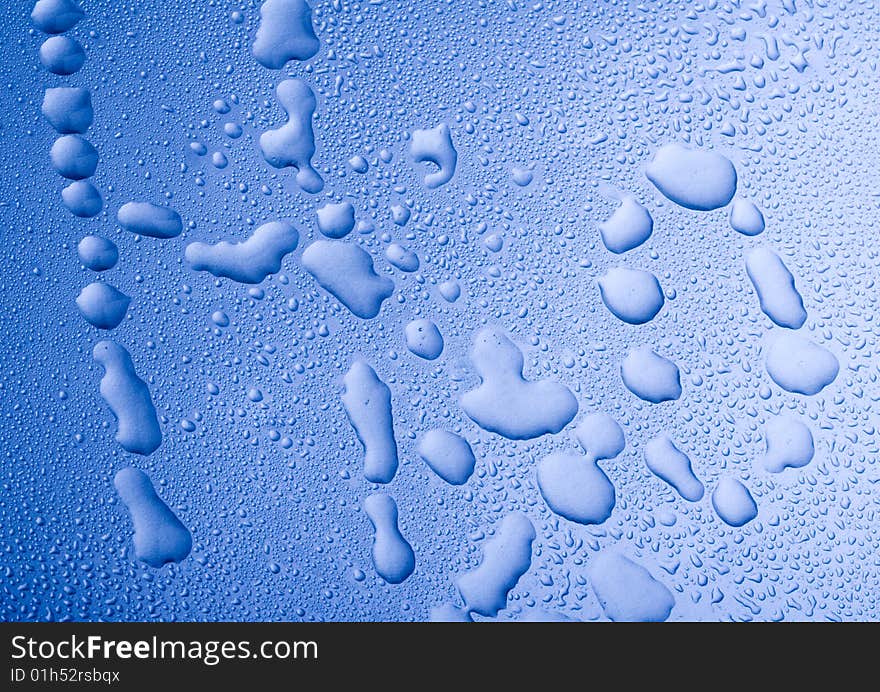 Mineral water drops on blue light background