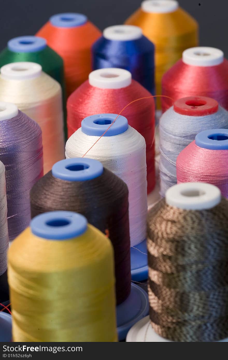 Selective focusing for shallow depth of field on this colorful display of spools of thread. Selective focusing for shallow depth of field on this colorful display of spools of thread