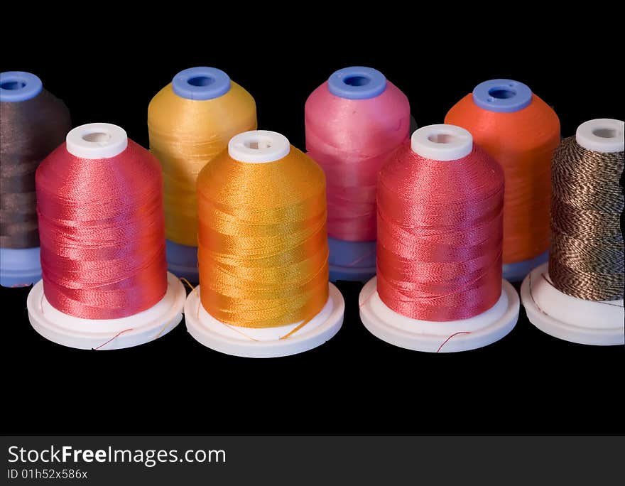 Selective focusing for shallow depth of field on this colorful display of spools of thread. Selective focusing for shallow depth of field on this colorful display of spools of thread