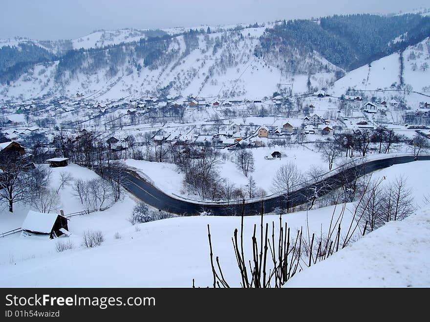 Winter landscape;Trees covered in snow;
A village in the mountains,in Romania. Winter landscape;Trees covered in snow;
A village in the mountains,in Romania