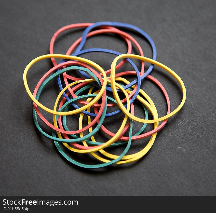 Rubberbands come in many assorted colors. Rubberbands come in many assorted colors.