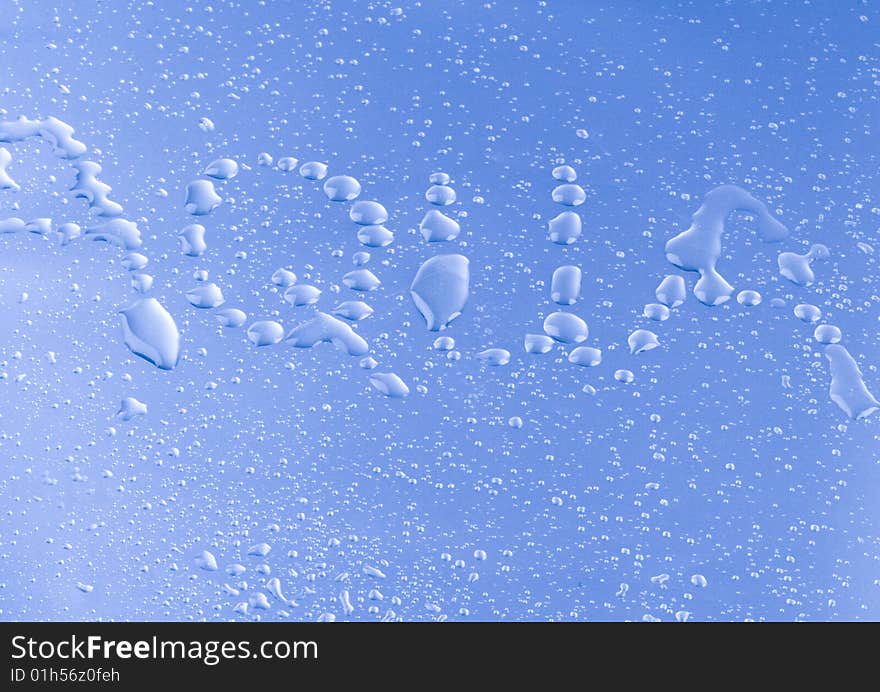 Mineral water drops on blue light background