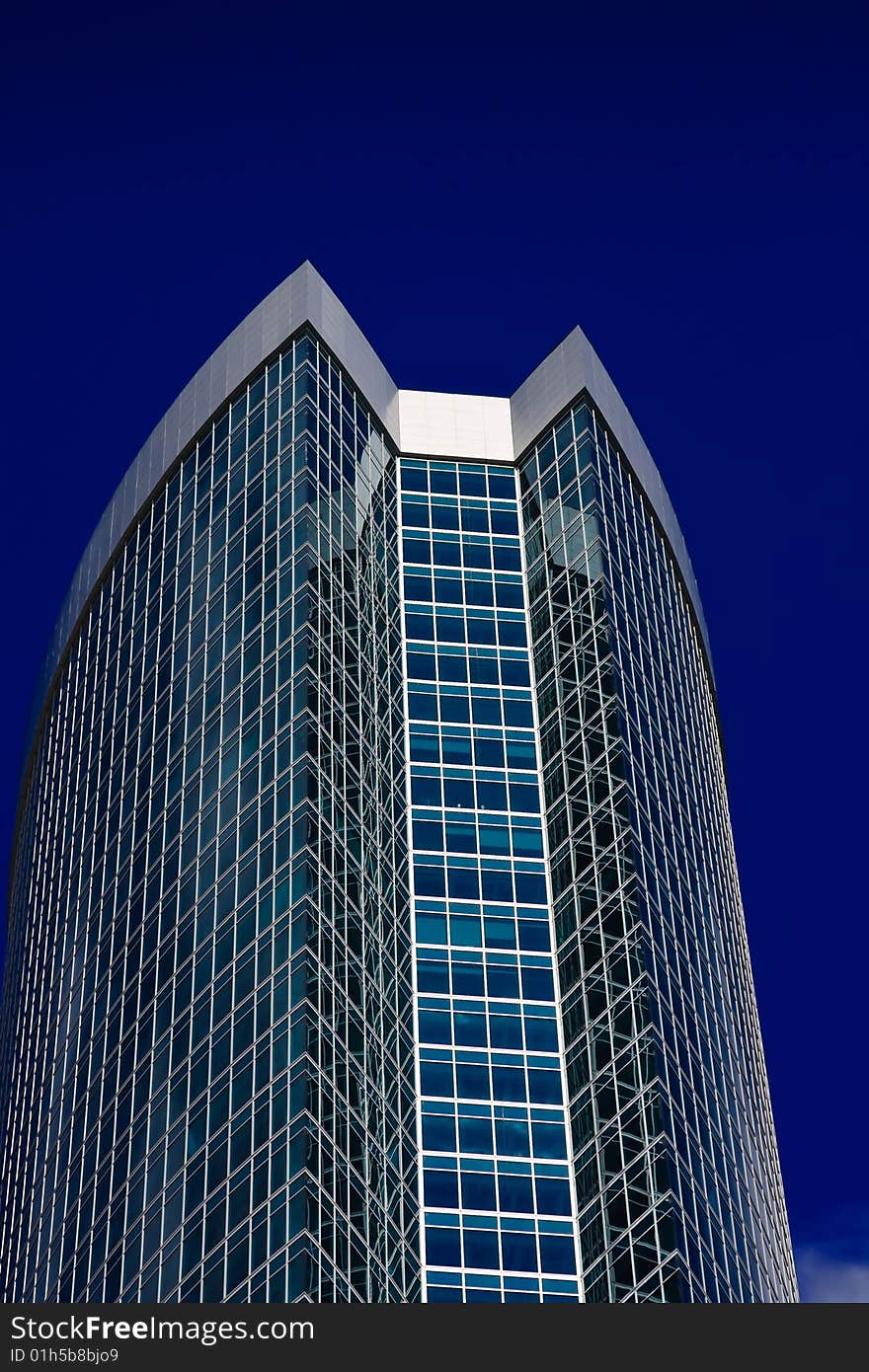 Modern office building over blue sky