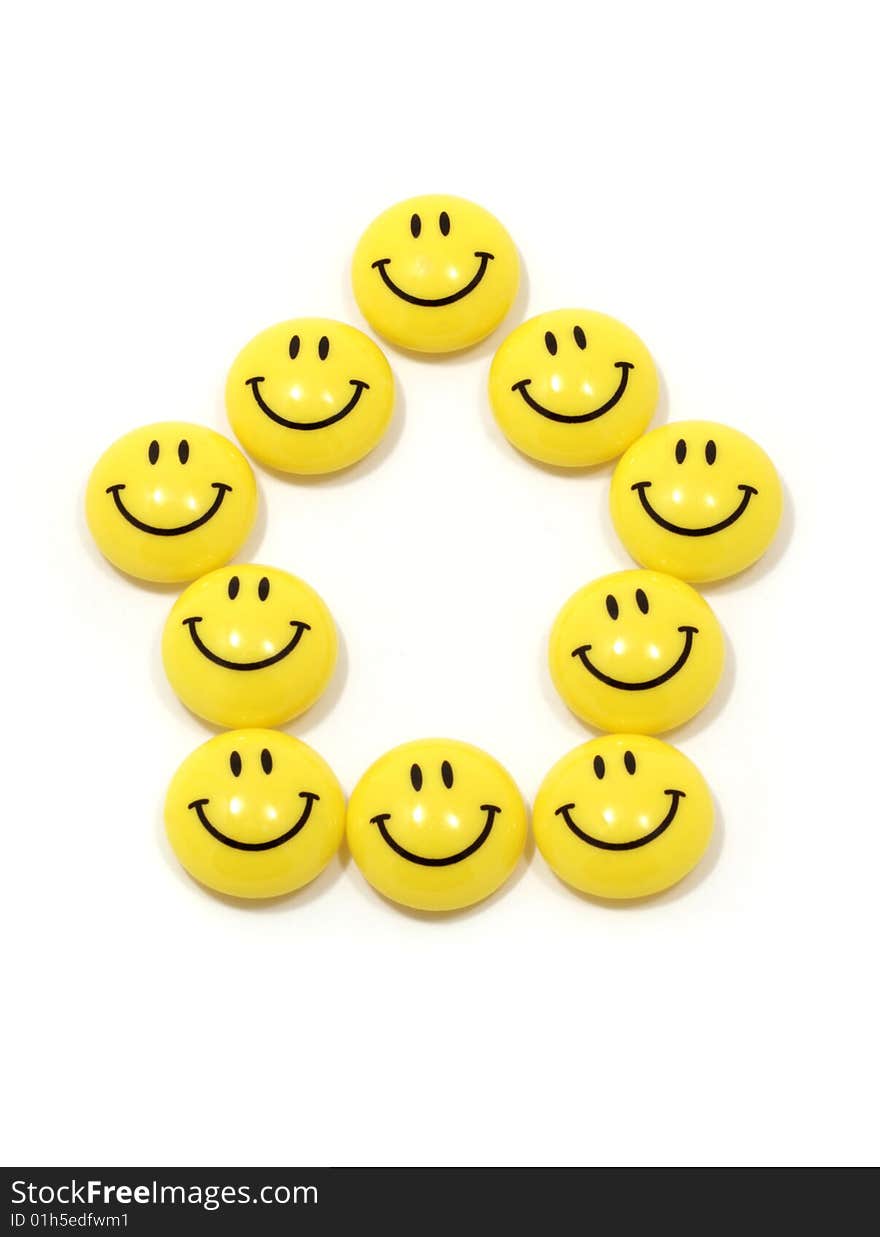 Image of the symbol of a house made of yellow smileys