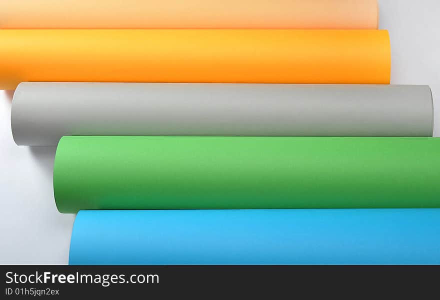 Colored rolled paper in white background