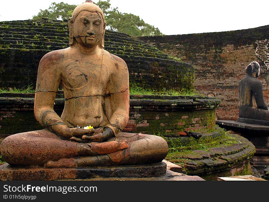 Four statues of seated Buddha are located in the Vatadage ancient house of relic in Polonnaruwa, Sri Lanka. Two of them are shown in the picture. Four statues of seated Buddha are located in the Vatadage ancient house of relic in Polonnaruwa, Sri Lanka. Two of them are shown in the picture.