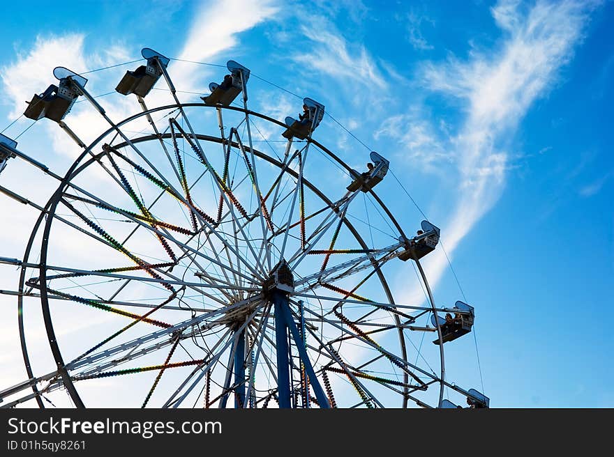 Ferris Wheel on blue sky background