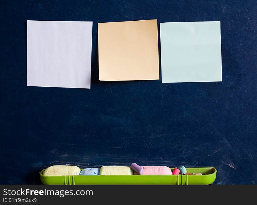 Stock photo: an image of three sheets of paper on blackboard. Stock photo: an image of three sheets of paper on blackboard