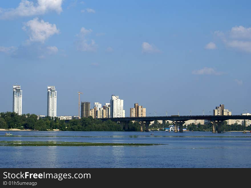 New microdistrict of Kiev. Skyscrapers tower over the river. New microdistrict of Kiev. Skyscrapers tower over the river