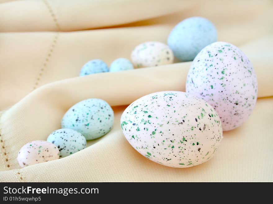 Colorful Easter eggs on a cloth background.