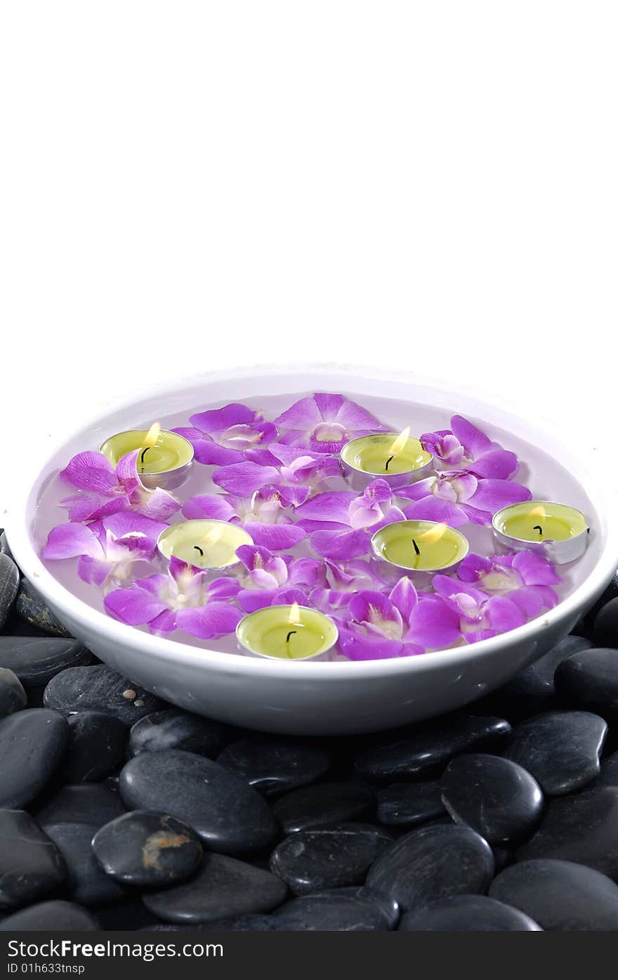 Floral scented water and black pebbles. Floral scented water and black pebbles