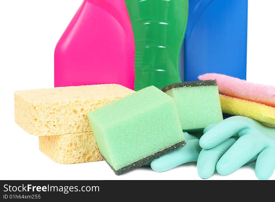 Variety of cleaning products such as sponges, gloves, and bottles with chemicals isolated on white background