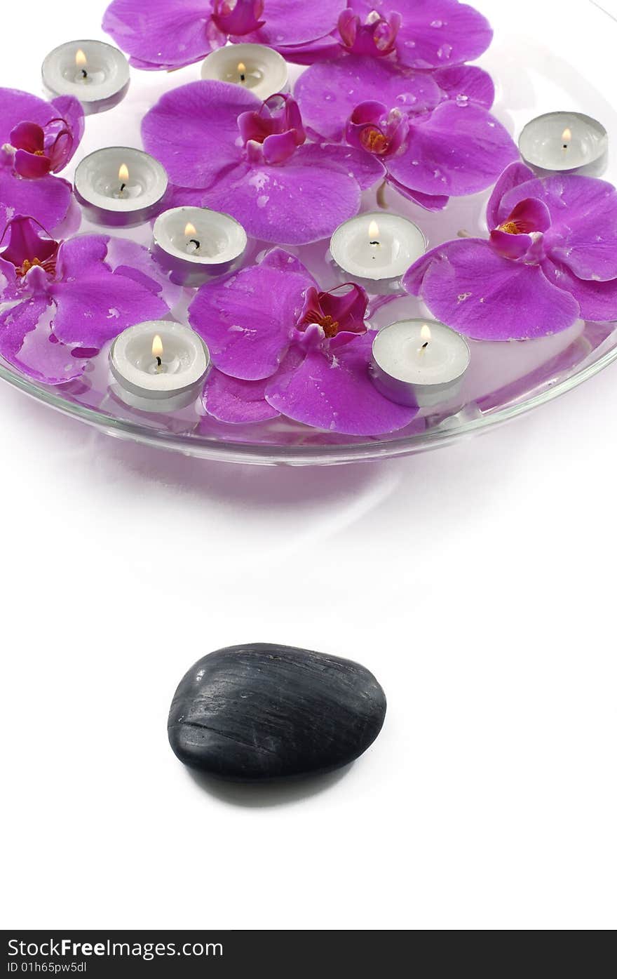 Therapy stones and floral scented water with candle. Therapy stones and floral scented water with candle