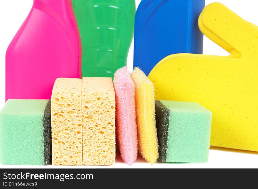 Variety of cleaning products such as sponges, gloves, and bottles with chemicals isolated on white background