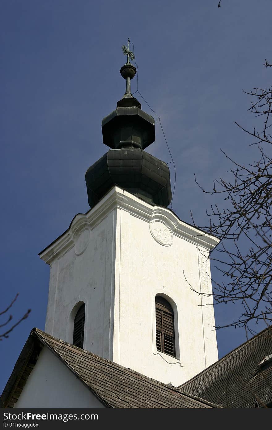 Spire of reformed church in village musem in Szenna, Hungary, Central Europe. Spire of reformed church in village musem in Szenna, Hungary, Central Europe