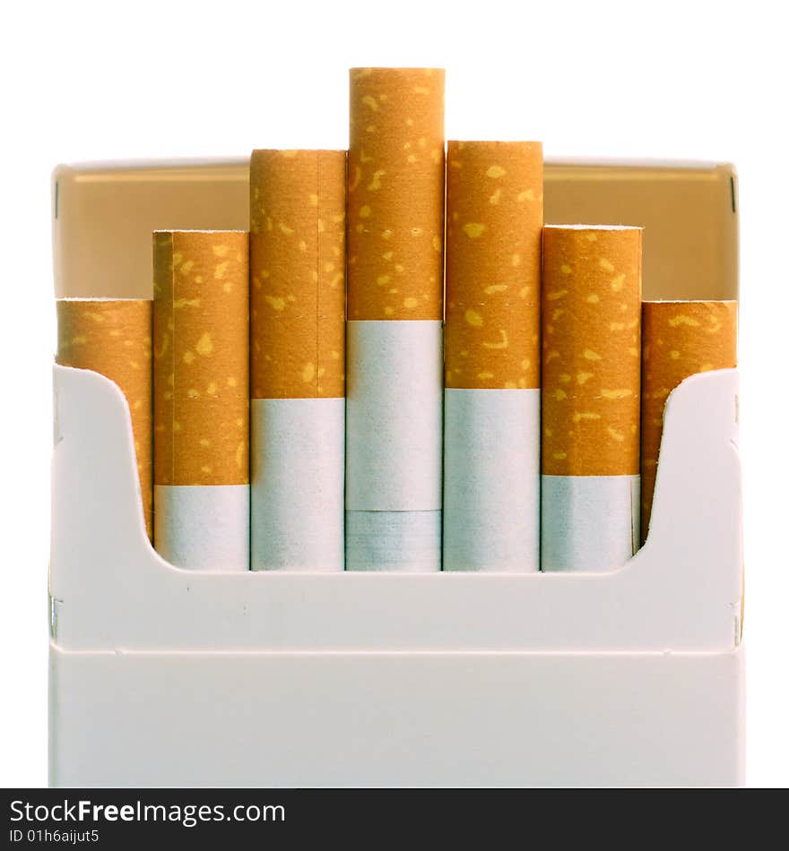 Pack of cigarettes with cigarettes sticking out isolated on white.