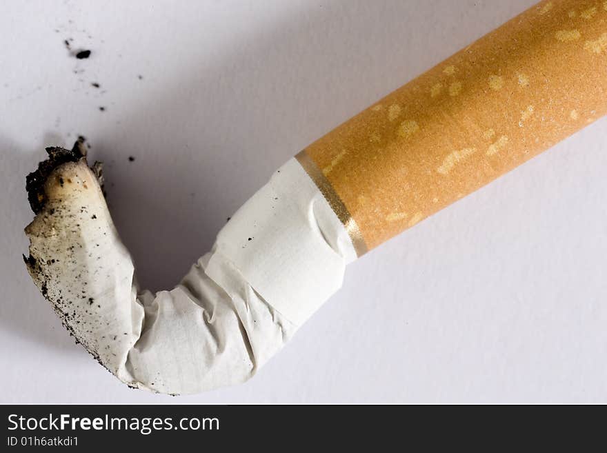 A cigarette butt on white