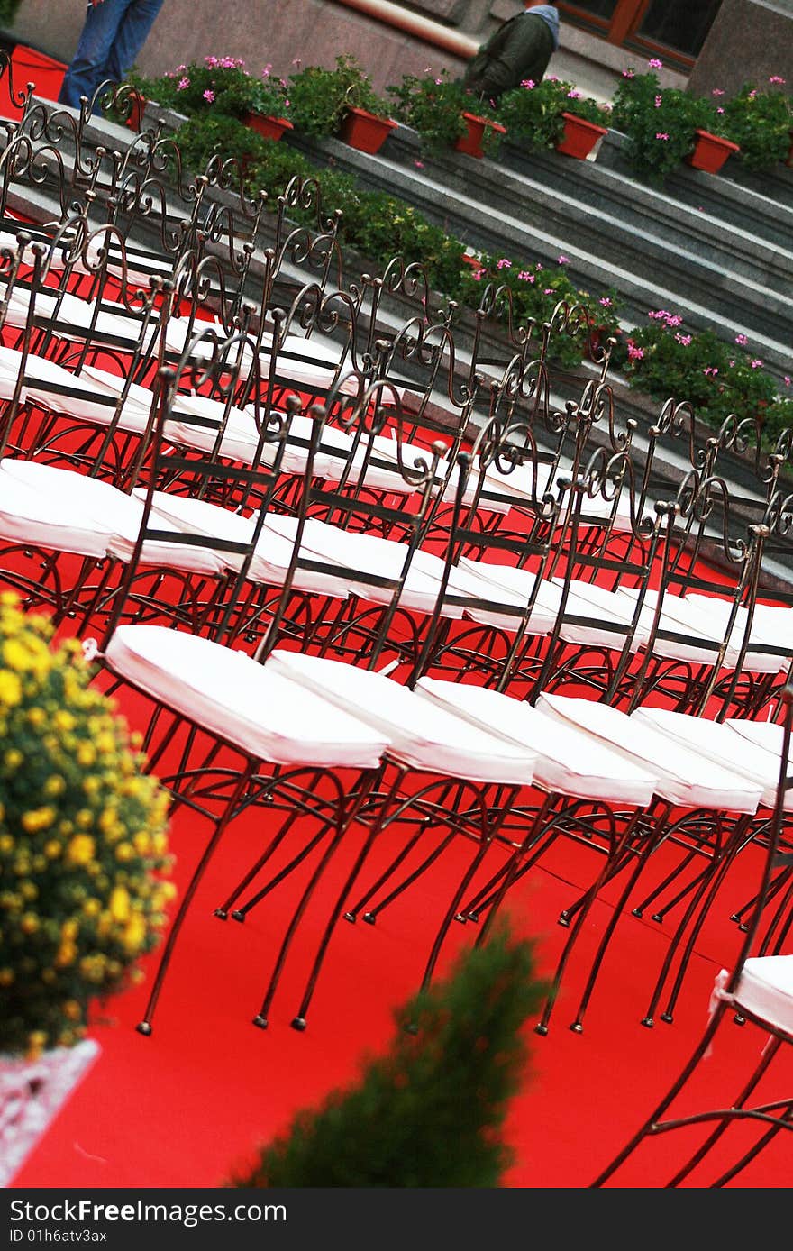 Many chairs on a red carper