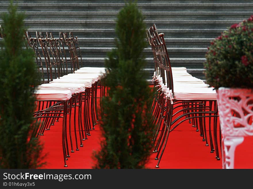 Many chairs on a red carper