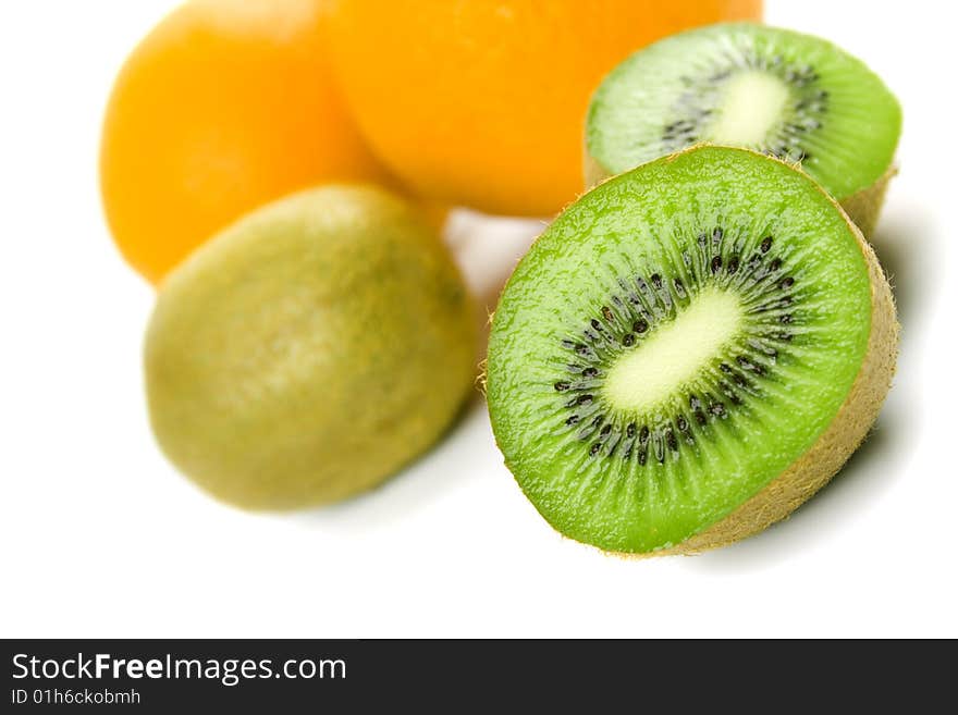 Oranges and kiwi on white background